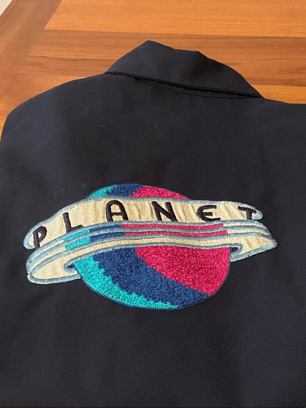 ‘Planet” embroidered logo on gabradine jacket